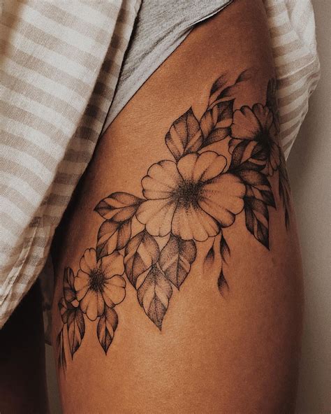 floral thigh tattoos